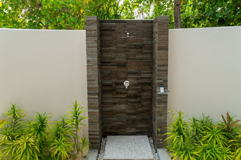Walk-in Shower Featuring Natural Stone